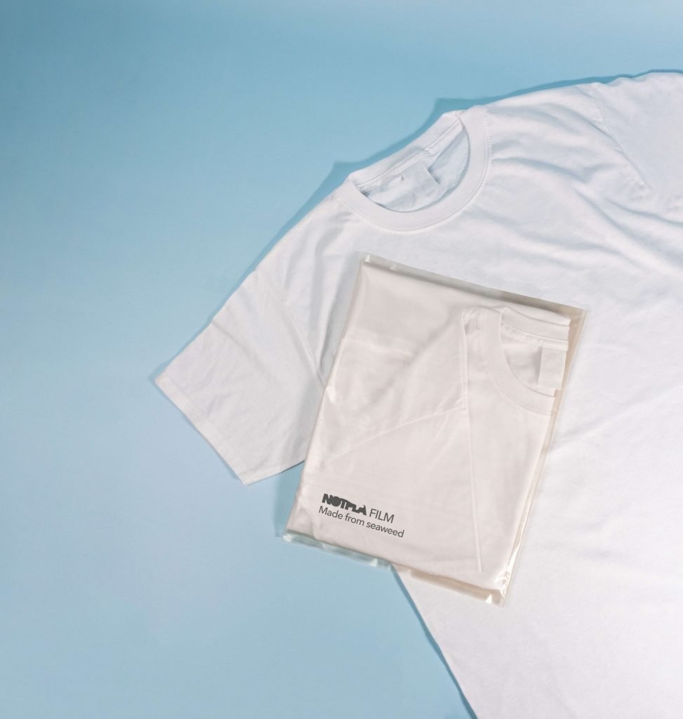 The Notpla alternative to thin-film plastic poly bags used to package clothing.